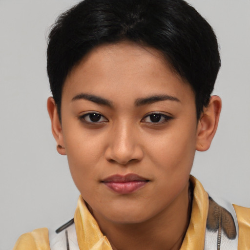 Joyful latino young-adult female with short  brown hair and brown eyes