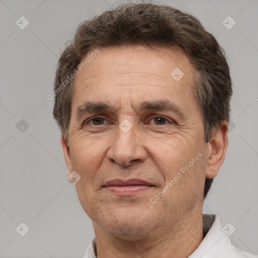 Joyful white middle-aged male with short  brown hair and brown eyes