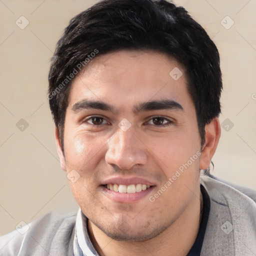 Joyful white young-adult male with short  black hair and brown eyes