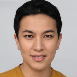 Joyful asian young-adult male with short  brown hair and brown eyes