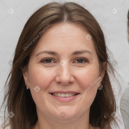 Joyful white adult female with medium  brown hair and brown eyes