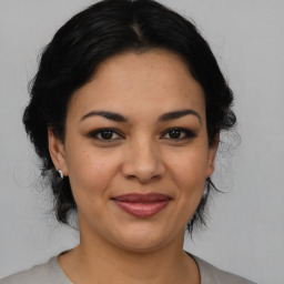 Joyful latino young-adult female with medium  black hair and brown eyes