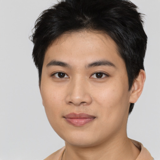 Joyful asian young-adult female with short  brown hair and brown eyes