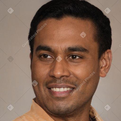 Joyful latino young-adult male with short  brown hair and brown eyes