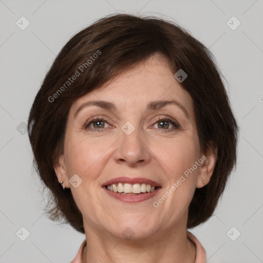 Joyful white adult female with medium  brown hair and grey eyes