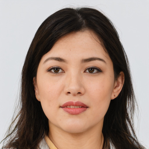 Joyful asian young-adult female with long  brown hair and brown eyes