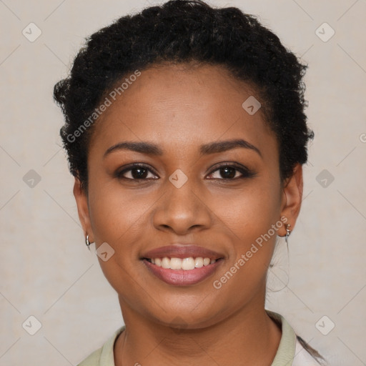 Joyful black young-adult female with short  brown hair and brown eyes