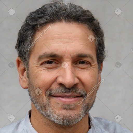 Joyful white middle-aged male with short  brown hair and brown eyes