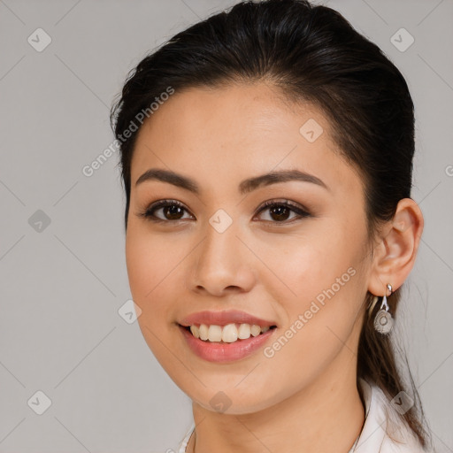 Joyful white young-adult female with long  brown hair and brown eyes