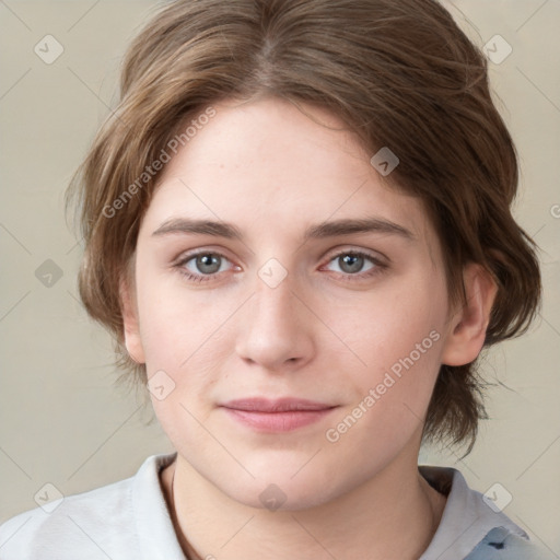 Joyful white young-adult female with medium  brown hair and blue eyes