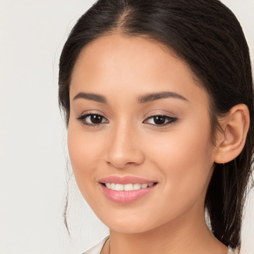 Joyful white young-adult female with long  brown hair and brown eyes