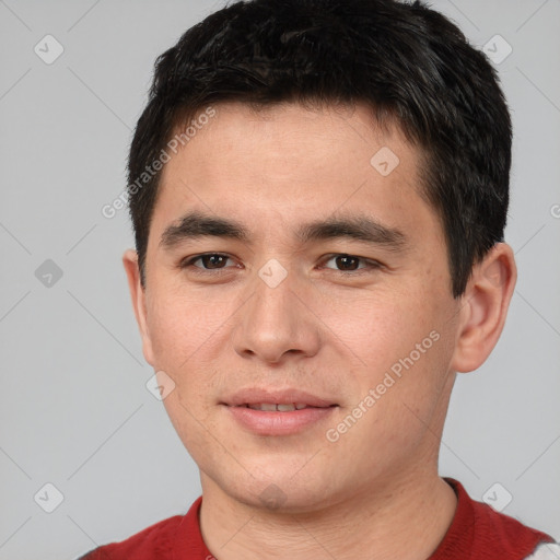 Joyful white young-adult male with short  black hair and brown eyes