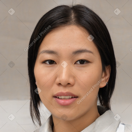 Joyful asian young-adult female with medium  black hair and brown eyes