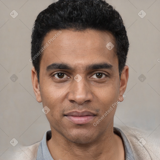 Joyful black young-adult male with short  black hair and brown eyes