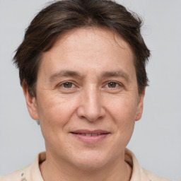 Joyful white adult female with short  brown hair and brown eyes