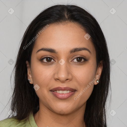 Joyful latino young-adult female with long  brown hair and brown eyes