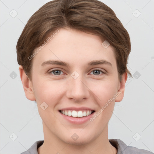 Joyful white young-adult female with short  brown hair and grey eyes