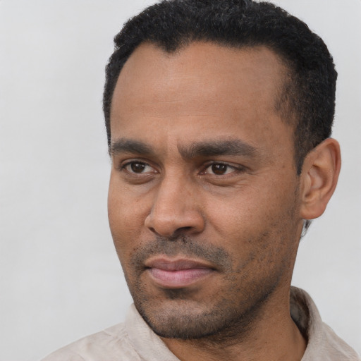 Neutral latino adult male with short  black hair and brown eyes