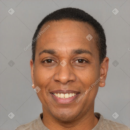 Joyful latino adult male with short  black hair and brown eyes