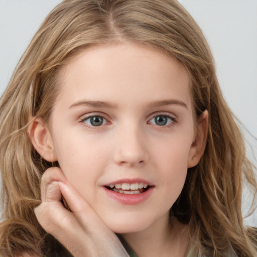 Joyful white child female with long  brown hair and blue eyes