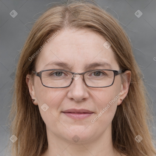 Joyful white adult female with long  brown hair and grey eyes