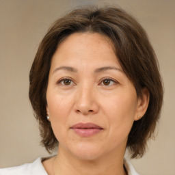 Joyful white adult female with medium  brown hair and brown eyes