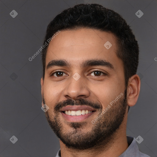 Joyful latino young-adult male with short  black hair and brown eyes