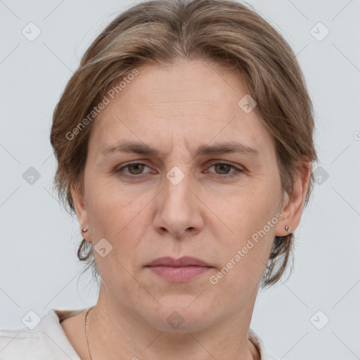 Joyful white adult female with medium  brown hair and grey eyes