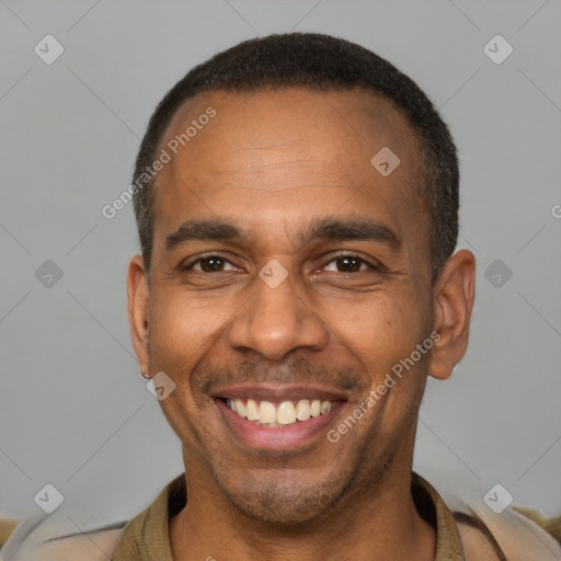 Joyful latino adult male with short  brown hair and brown eyes