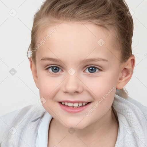 Joyful white child female with short  brown hair and grey eyes