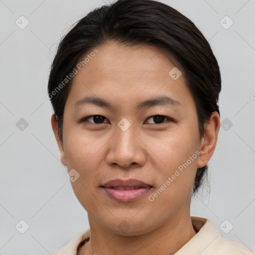 Joyful asian young-adult female with short  brown hair and brown eyes