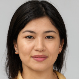 Joyful asian young-adult female with medium  brown hair and brown eyes