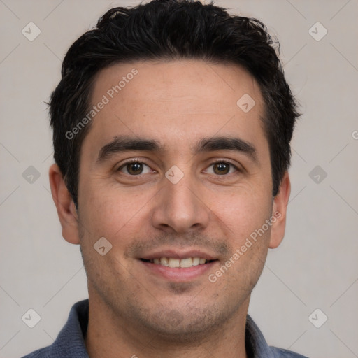 Joyful white young-adult male with short  black hair and brown eyes