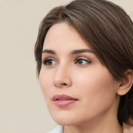 Neutral white young-adult female with medium  brown hair and brown eyes