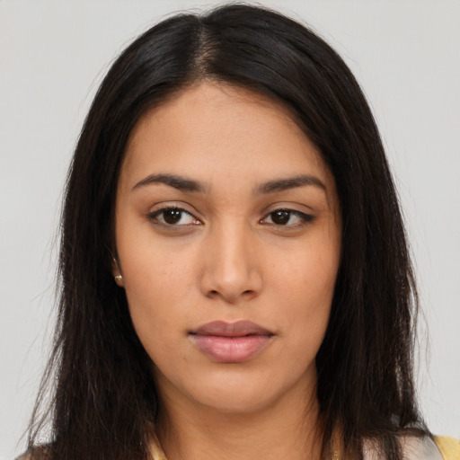 Neutral latino young-adult female with long  brown hair and brown eyes