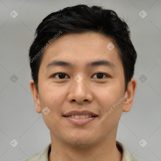 Joyful asian young-adult male with short  brown hair and brown eyes