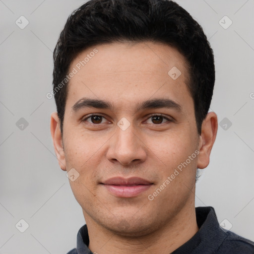 Joyful white young-adult male with short  black hair and brown eyes