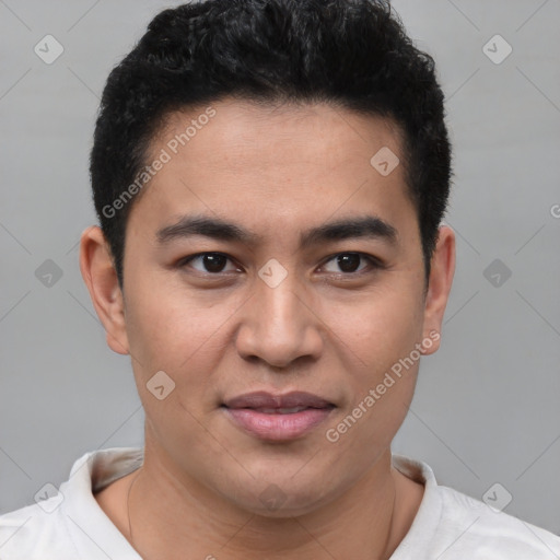 Joyful latino young-adult male with short  brown hair and brown eyes
