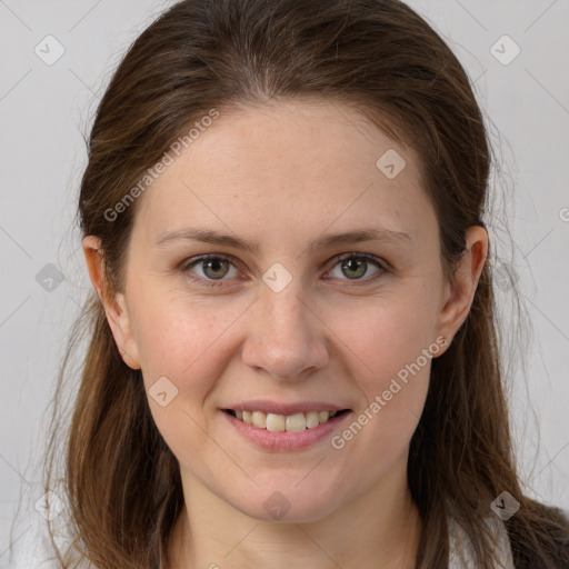 Joyful white young-adult female with long  brown hair and grey eyes