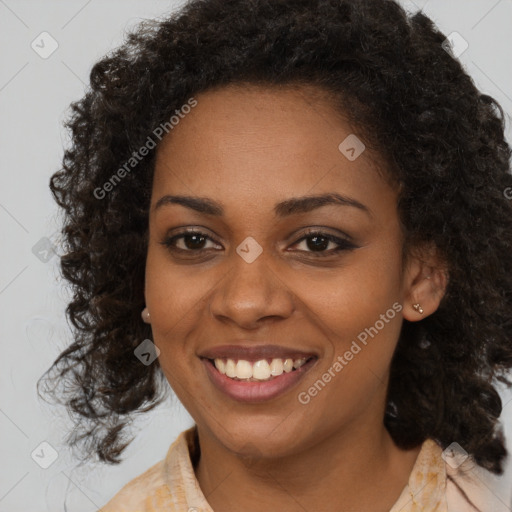 Joyful black young-adult female with medium  brown hair and brown eyes