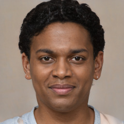 Joyful latino young-adult male with short  brown hair and brown eyes