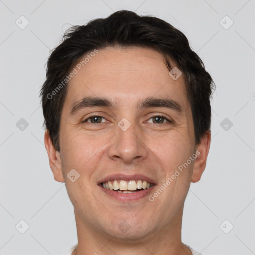 Joyful white adult male with short  brown hair and brown eyes