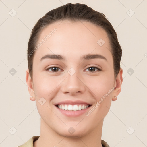 Joyful white young-adult female with short  brown hair and brown eyes