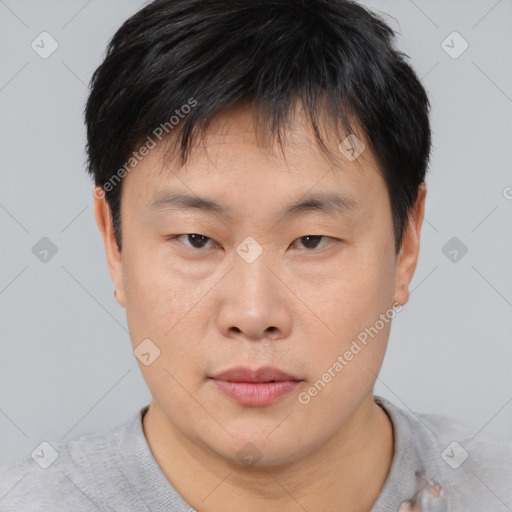 Neutral asian young-adult male with short  brown hair and brown eyes