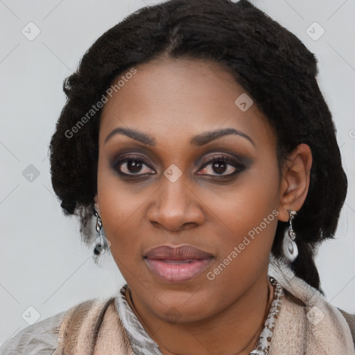 Joyful black young-adult female with long  black hair and brown eyes