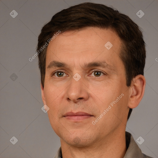 Joyful white adult male with short  brown hair and brown eyes