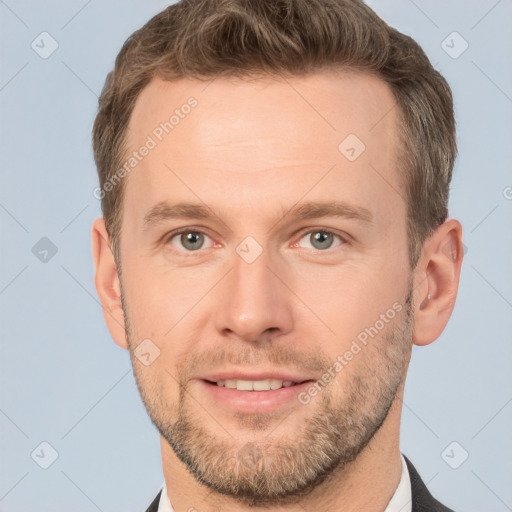 Joyful white adult male with short  brown hair and brown eyes