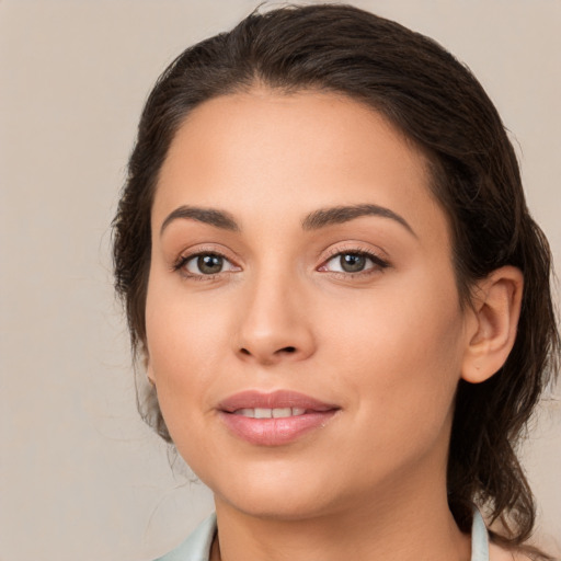 Joyful white young-adult female with medium  brown hair and brown eyes