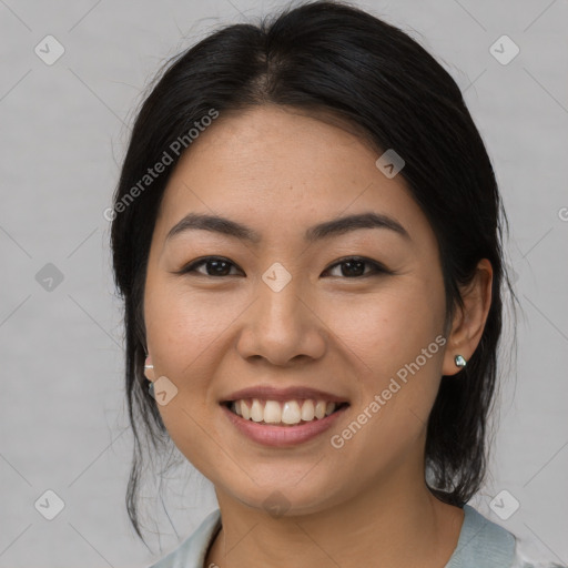 Joyful asian young-adult female with medium  black hair and brown eyes