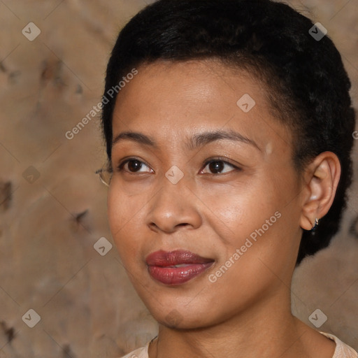 Joyful black young-adult female with short  black hair and brown eyes